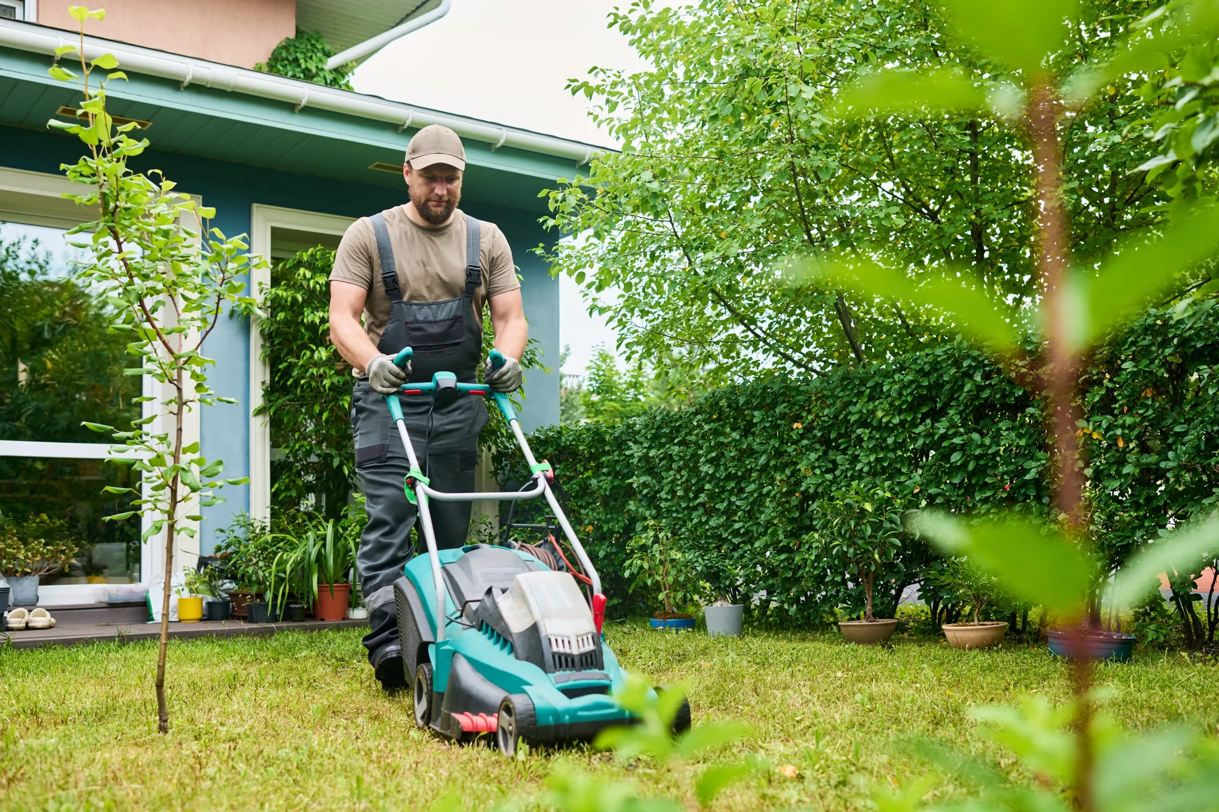 Mowing a backyard lawn